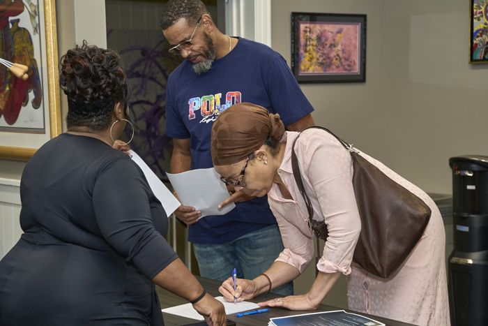 Neighbors signing in at the door